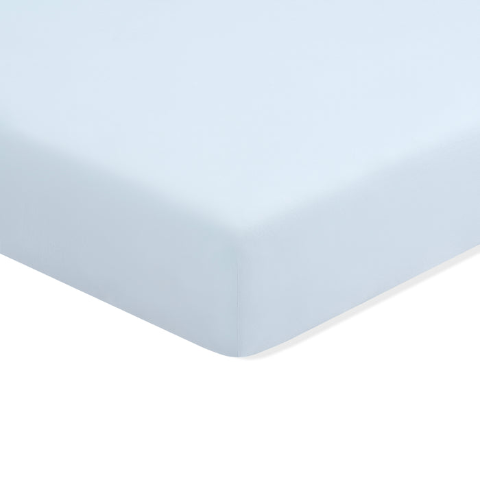 Mini Crib Sheet in Breeze shown on a mattress