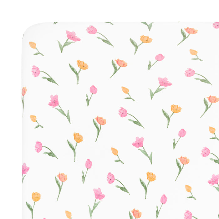 Close up of the Mini Crib Sheet in Tulip shown on a mattress