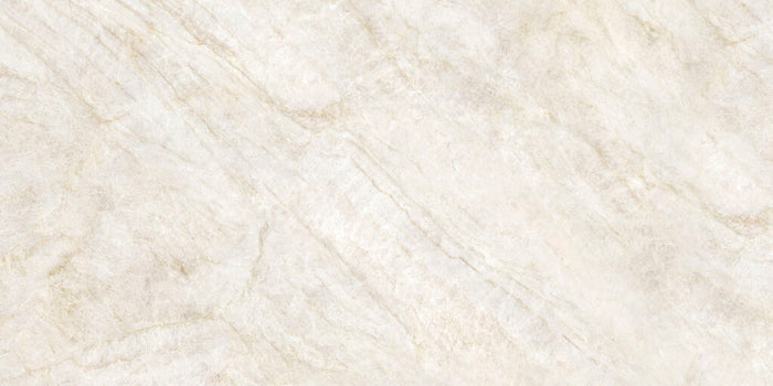 A close-up of a light beige marble or stone surface with soft cream and warm tan veining.