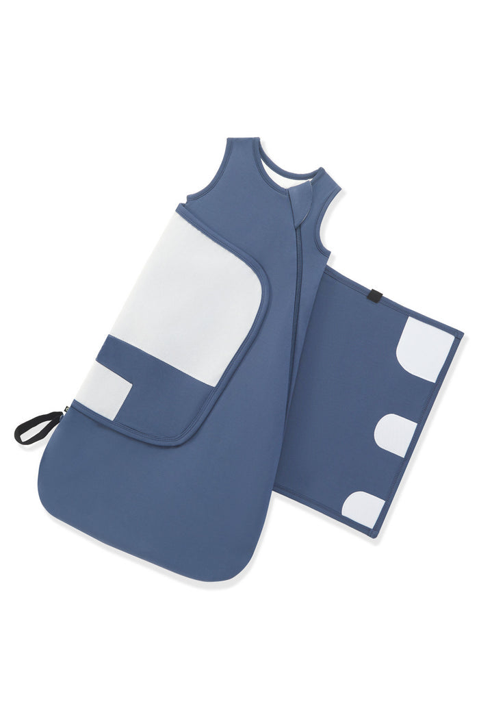 Adjustable velcro strap shown on an unswaddled Sleep Bag Swaddler in Oxford 1.0 on a white background