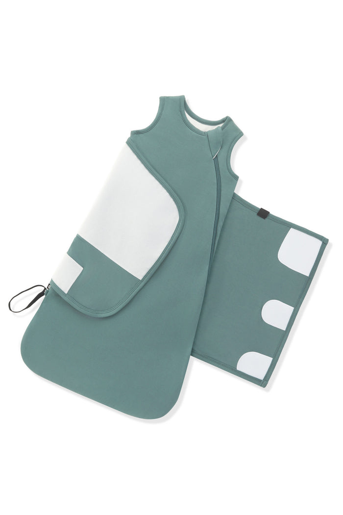 Adjustable velcro strap shown on an unswaddled Sleep Bag Swaddler in Pine 1.0 on a white background